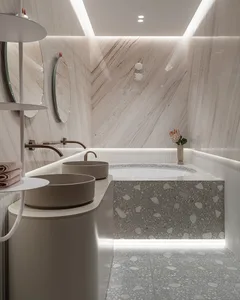 Modern minimalist bathroom featuring marble walls and a terrazzo-tiled floor with a freestanding tub and dual vanity sinks.
