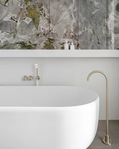 A modern bathroom featuring a freestanding bathtub made of marble.