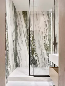 A modern minimalist bathroom featuring marbled walls and a floating vanity.