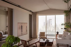 An elegantly designed modern living room featuring beige tones and soothing neutral decor, offering breathtaking panoramic ci