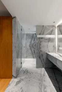 Modern, minimalist bathroom designed with marble materials.