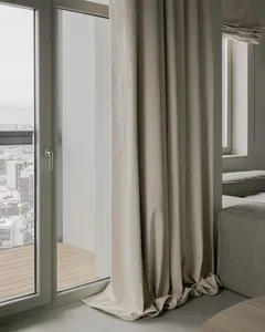 A minimalist room with a modern white curtain and a window overlooking the city.