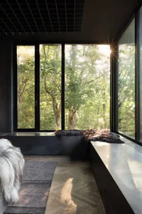 Modern windowsill featuring a textured wallpaper design, providing a cozy and sophisticated ambiance.