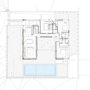 Floor plan of a modern residential building with a mix of wood, concrete, and glass materials.