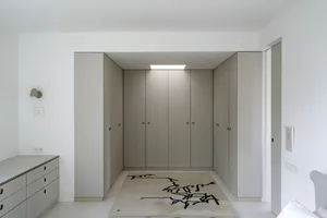 A minimalist interior with modern storage space.