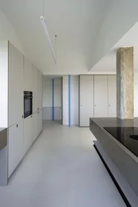 Modern kitchen featuring concrete flooring and minimalist design