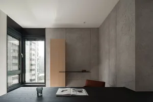 Modern office space featuring industrial design and concrete finishes.