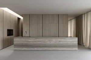Modern kitchen with marble countertops and integrated appliances