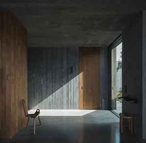 Modern entryway featuring wooden and concrete materials.