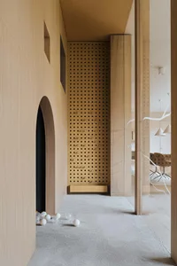 A modern playroom featuring wooden walls and a ball pit with white balls