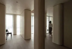 Modern residential space featuring neutral tones and minimalist design elements.
