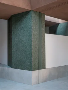 A modern interior design featuring a concrete pillar column in a reception area.