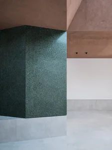 Modern interior space featuring concrete floor and walls, minimalistic design