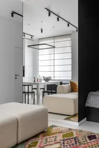 A modern living room with textured fabric furniture, minimalist decor, and natural light.