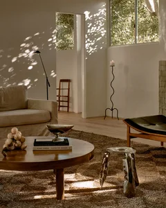 A modern living room with minimalist furniture and natural light.