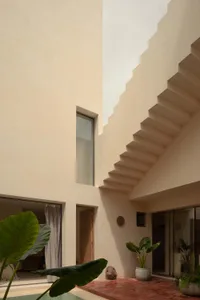 Modern interior design featuring concrete and glass materials.