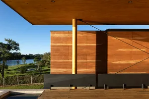 Modern exterior design featuring wooden cabin with natural landscape view.