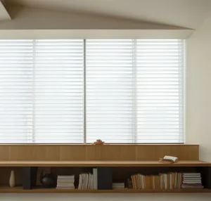 A minimalist interior design featuring a window with shelves made of natural wood, containing neatly stacked books and decora