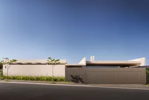 Modern residential home with concrete exterior and minimalist design.
