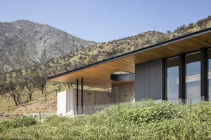 A modern building exterior made of concrete and wood.