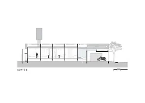 Cross-section of a modern house featuring glass, concrete, and steel elements.