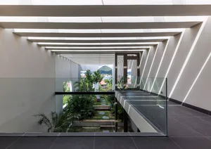Modern interior space with glass walls and concrete floors.