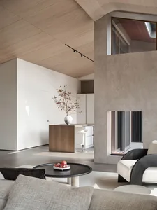 Modern living room featuring concrete and wooden elements.