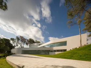 Modern house with minimalist design and concrete exterior.