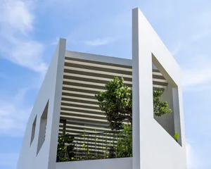 Modern minimalist concrete building exterior in sea green color