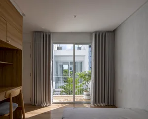A modern minimalist bedroom showcasing clean lines and a serene atmosphere.