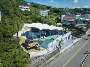 A contemporary residential house with a glass exterior.