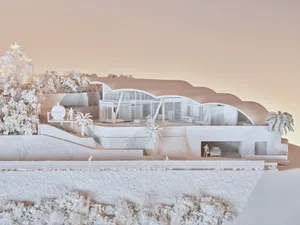 A modern residential architectural model in a white on white color scheme, showcasing clean lines and open space.