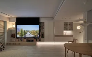 A modern minimalist living room with light wood furniture, grey textiles, and white decor.