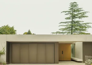 Modern residential home with concrete facade and minimalist design.