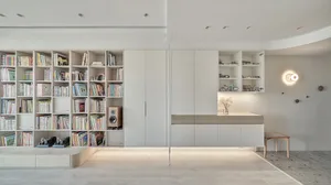 Minimalist living room featuring modern furniture and a wooden floor.