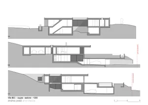 Floor plan of a modern house with concrete and glass materials.