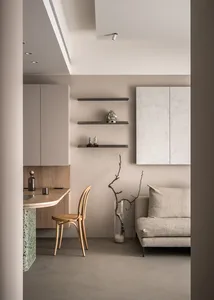 A modern, minimalist interior design featuring concrete elements.