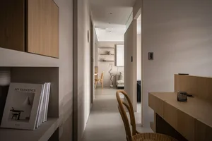 Modern minimalist hallway with wood furniture and white walls