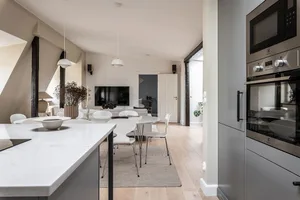 Modern, minimalist residential interior featuring concrete elements.