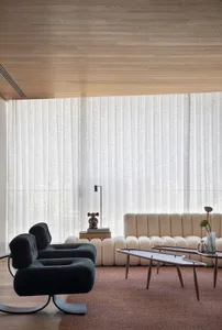 Modern interior design featuring fabric curtains in a living room.