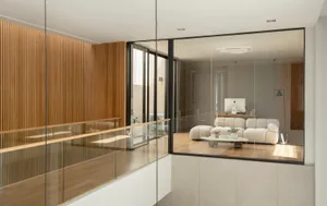 Modern living room featuring wood and glass materials