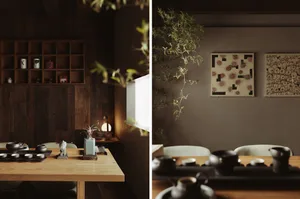 A minimalist interior space featuring wooden furniture and decor elements.