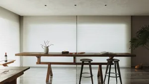Modern minimalist living area with wooden furniture and glass windows