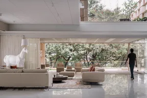 Modern living room featuring concrete elements.