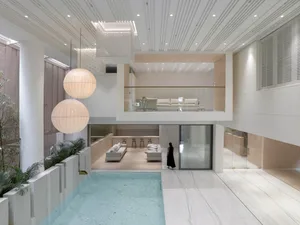 A modern residential space featuring marble, glass, and wooden elements.