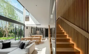 Modern residential interior featuring wood elements and a spacious, open design