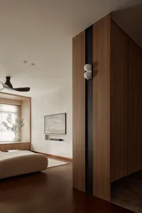 A bedroom with a minimalist design featuring wooden and concrete elements.