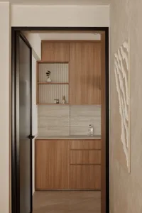 Minimalist kitchen pantry with wooden cabinets and shelves.