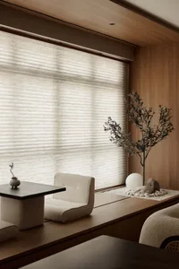 Modern living room with wooden furniture and minimalist style, featuring a cozy and contemporary atmosphere.