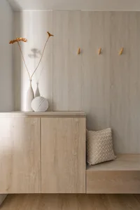 Modern entryway with a wooden cabinet and minimalist design